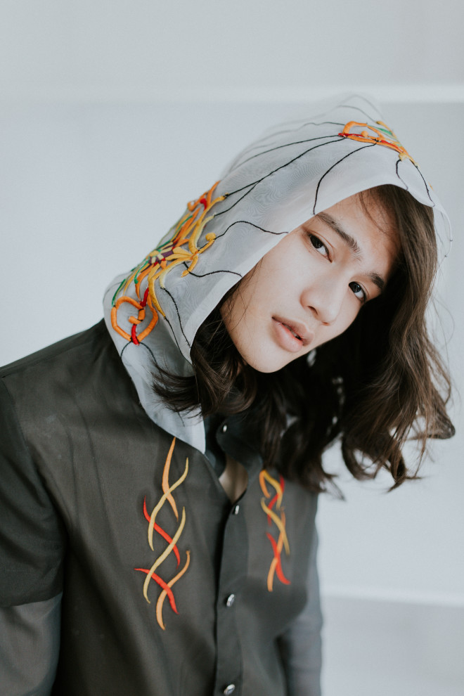JORGE BRIONES Layered barong in charcoalcolored jusi with embroidered hood and front panels