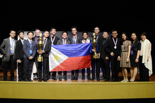 Ateneo High School debate contingent proudly hoists the Philippine flag at the end of the Hong Kong tournament. Ateneo de Manila High School is the reigning Asian champion team, crowned in Kuala Lumpur in June 2016. —LANI BUAN-DE LEON