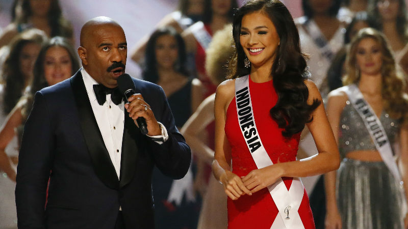 Kezia Warouw of Indonesia prepares to answer a question from host Steve Harvey after making it to the top 13 in the Miss Universe 2016 competition Monday, Jan. 30, 2017, at the Mall of Asia in suburban Pasay city, south of Manila, Philippines. (AP Photo/Bullit Marquez)