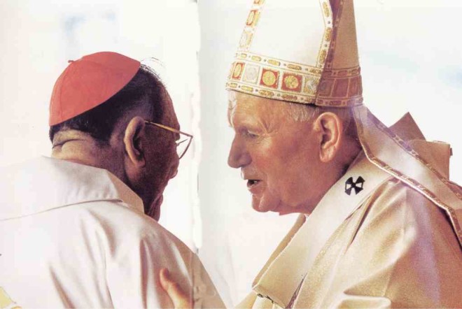 An intimate moment captured by Noli, an exchange between twomuch-missed men ofGod, Jaime Cardinal Sin and Pope (now Saint) John Paul II