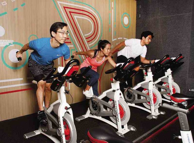 The total body workout combines pedaling the legs while pumping light weights to activate the smaller muscles on the arms and shoulders. NELSON MATAWARAN