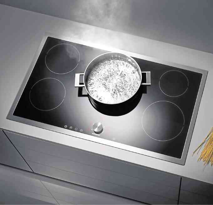Induction cooktop blends almost invisiblywhen switched off, showcasing Gaggenau’s knack for minimalist design.