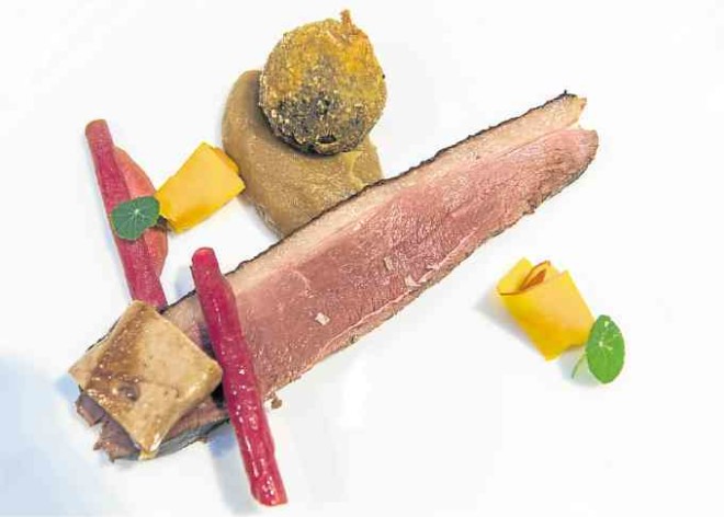 Duck Trio. Duck leg confit, roast duck breast, pan-seared foie gras, caramelized onion cream, Potimarron pumpkin, nasturtium leaves