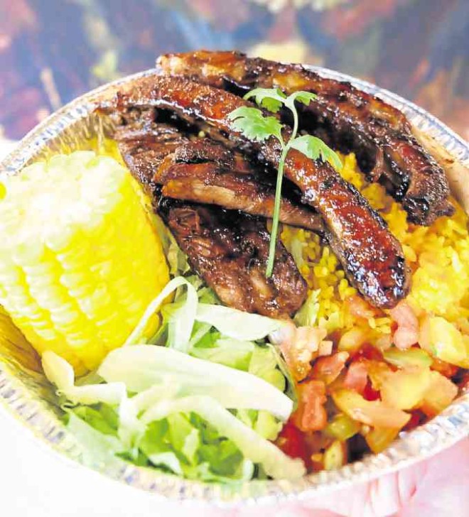 Street Grub’s coffee rubbed BBQ ribs with yellow rice, salsa, lettuce, and sweet corn (photo from Facebook)