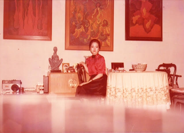 Undated photo of Nikki Coseteng with key H.R. Ocampo works behind her: “Untitled,” “Starward” and “Votive Forms.”