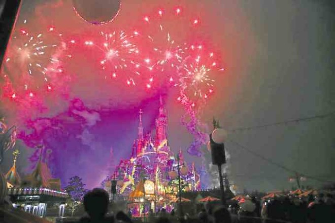 Fireworks light up the sky in Shanghai Disneyland.
