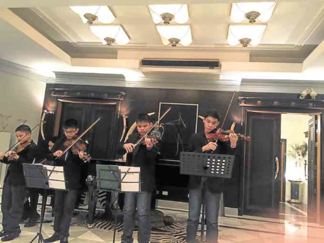 Alfonso, Agu, Azi, Amanu—sons of Czarina and Dr. Jose Fernando Syquia—do their violin repertoire after dinner.