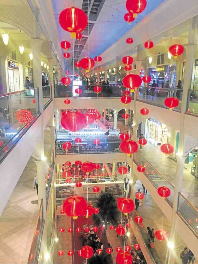 A festive rain of red lanterns welcomes the Year of the Rooster at the Power Plant Mall in Rockwell.