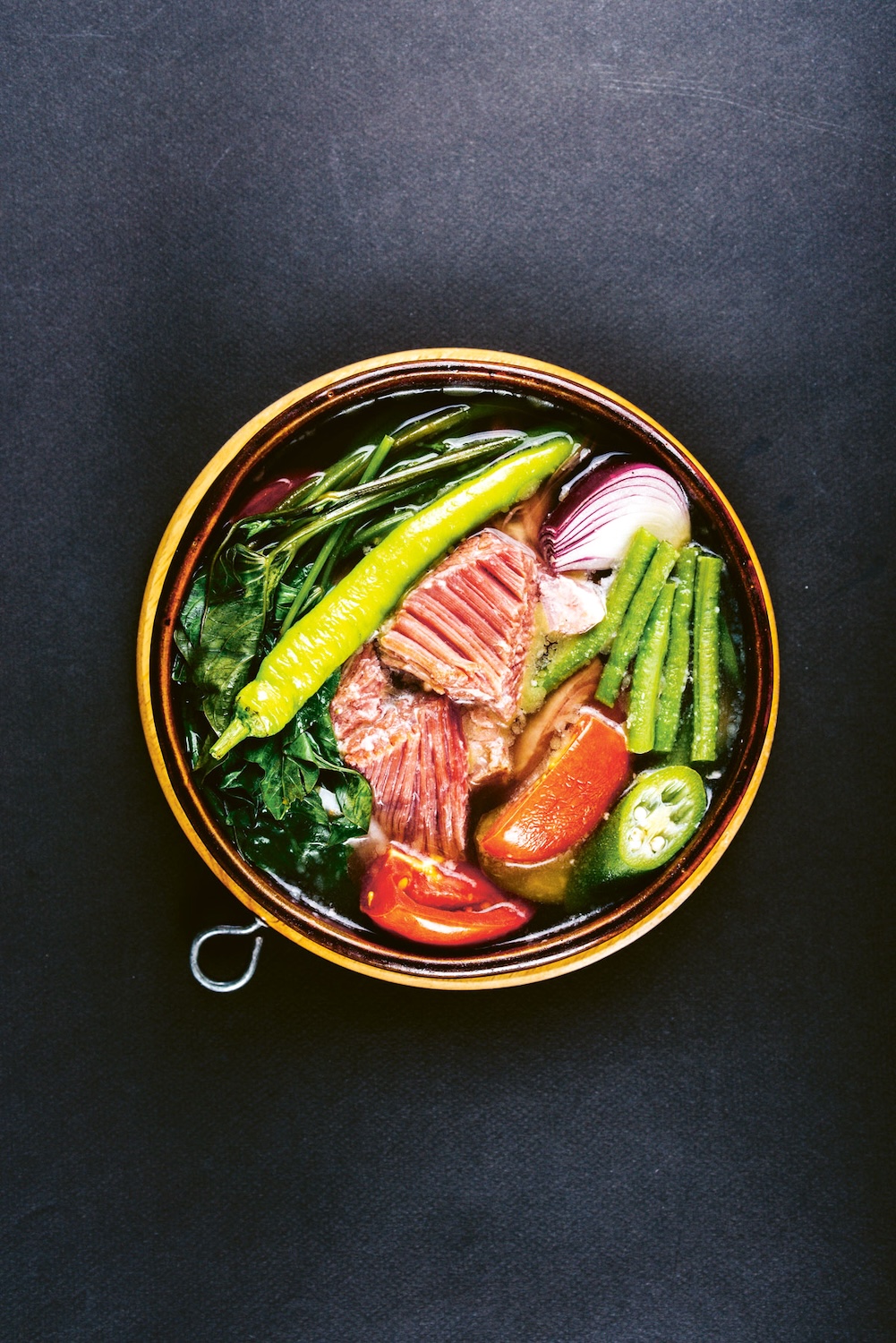 One of the signature dishes of Filipino cuisine is the sour and versatile sinigang