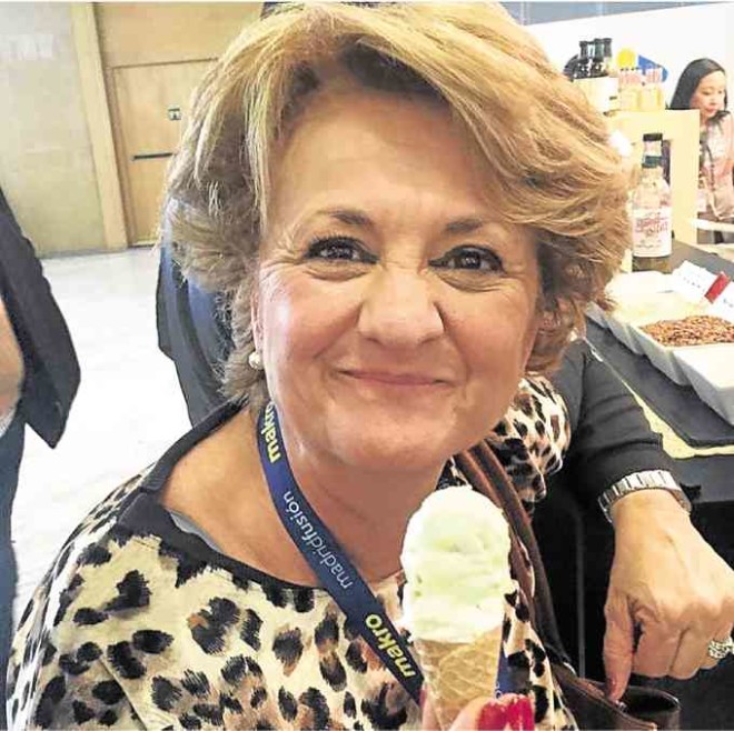 A Spanish guest enjoying her scoop of coconut ice cream