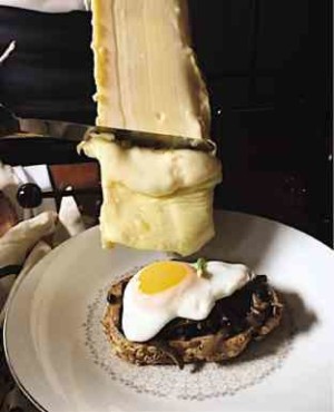 A sight to behold: the smothering of melted raclette on Wild Mushroom Toast—CHICHI TULLAO
