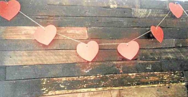 After cutting out the paper hearts, string each of them in equal distances.