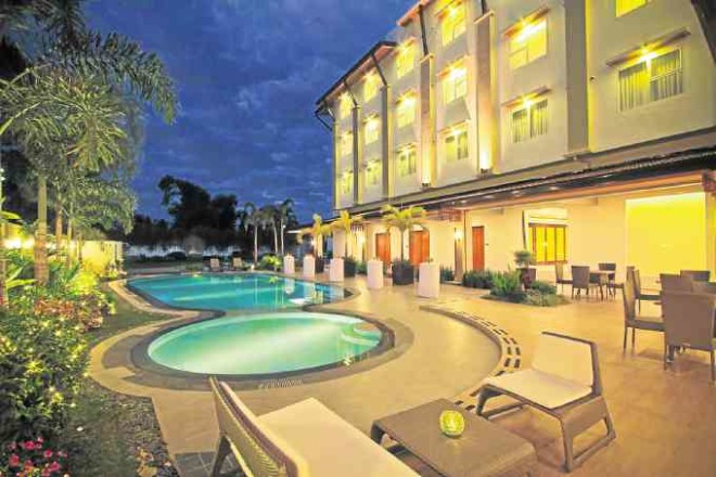 Poolside area  of Harvest Hotel in Cabanatuan City 
