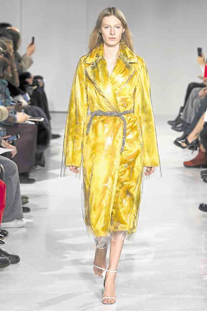 Plastic. Yellow fur coat shrouded in PVC