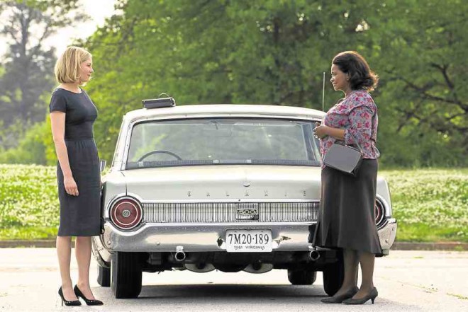 Kirsten Dunst and OIctavia Spencer in a scene from “Hidden Figures” 