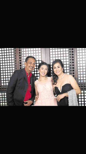 The debutante with parents Jorge and Tess Catapang