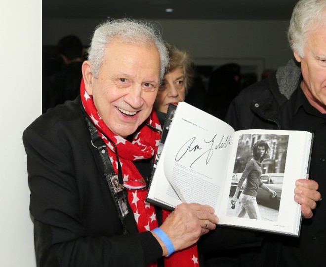 NEW YORK, NY - NOVEMBER 16: Photographer Ron Galella poses with his photo of Jacqueline Kennedy Onassis from the book TIME's 100 Most Influential Photos Of All Time during the TIME's 100 Most Influential Photos Of All Time Event on November 16, 2016 in New York City.   Jemal Countess/Getty Images for TIME/AFP