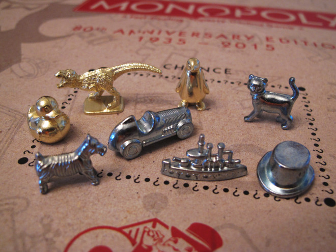 This March 15, 2017 photo shows the eight game tokens that will be included in upcoming versions of the Monopoly board game, in Atlantic City, N.J. Hasbro Inc. revealed the results of voting on Friday, March 17, 2017. Leaving the game will be the boot, wheelbarrow and thimble tokens, replaced by a ducky, T-Rex dinosaur and a penguin. (AP Photo/Wayne Parry)