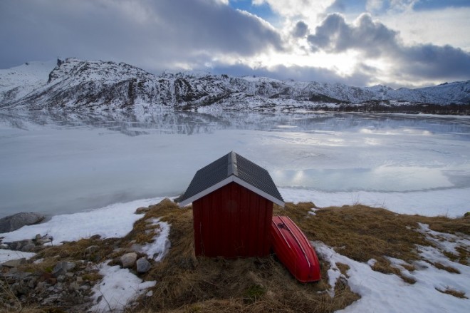 (FILES) This file photo taken on March 15, 2016 shows a private fishing cabin at a fjord near Svolvaer, in Lofoten archipelago, Arctic Circle.  A bit of cold isn't keeping Norway from basking in the warmth of being the world's happiest country, a UN report found out on March 20, 2017. And Norway surged from 4th place in last year's assessment all the way to the top spot, even though oil prices are down, the World Happiness Report 2017 said. The top four also included Nordic neighbors neighbors Denmark and Iceland as well as Switzerland.  / AFP PHOTO / OLIVIER MORIN