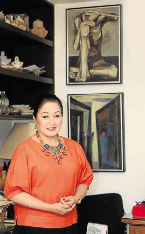 Former Senator Nikki Coseteng wears one of the many necklaces she designed using beads collected through the years.