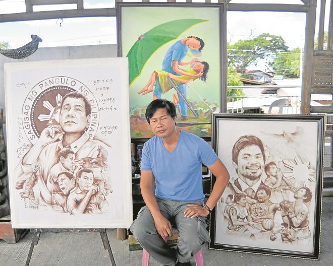 he artist at his atelier with his most popular works, one of which went viral online