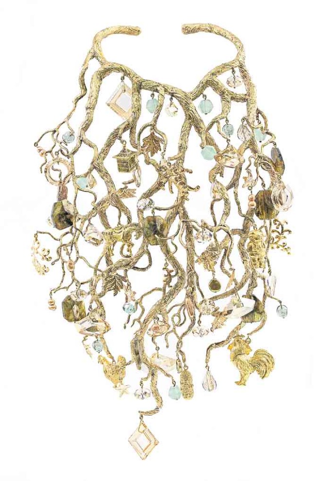 A neckpiece (above) from Ong’s 2016 couture collection, sculpted in the form of a large coral branch. From it are suspended labradorite beads, repoussé leaves, frosted green glass, Swarovski crystals, button pearls and assorted sculpted charms.