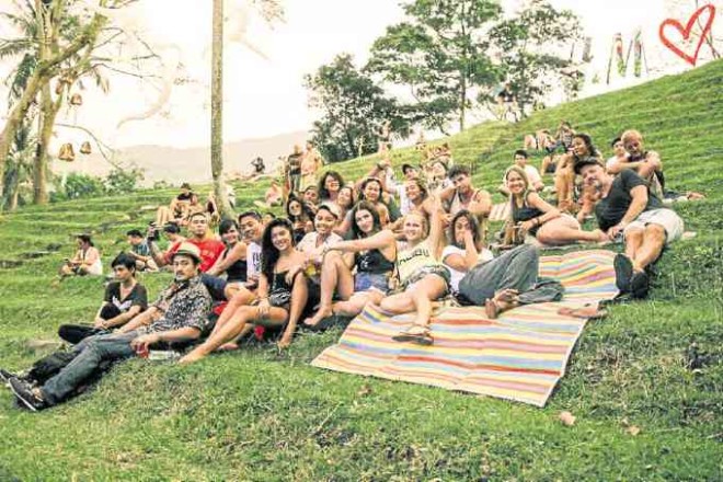 Festivalgoers chill by the Malasimbo Amphitheatre where the festival is staged yearly. 