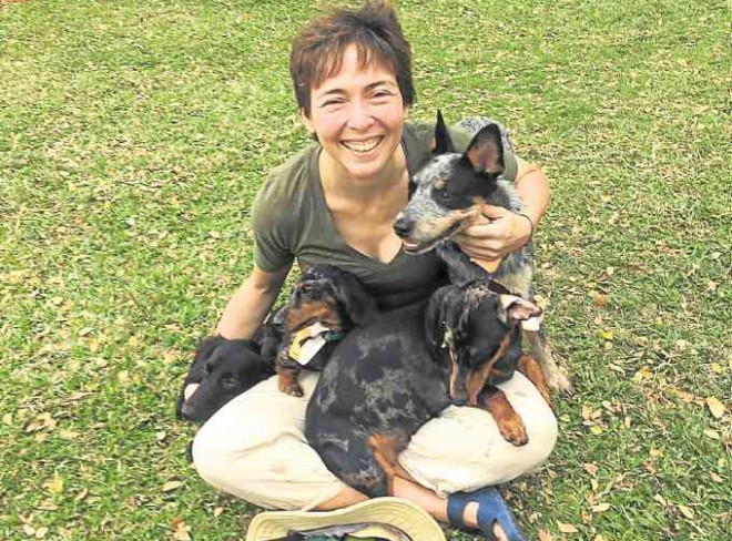 Rina Ortizwith her pack, Dachshunds Helix, Pinit and Nimbus, and Australian Cattle Dog Tufay