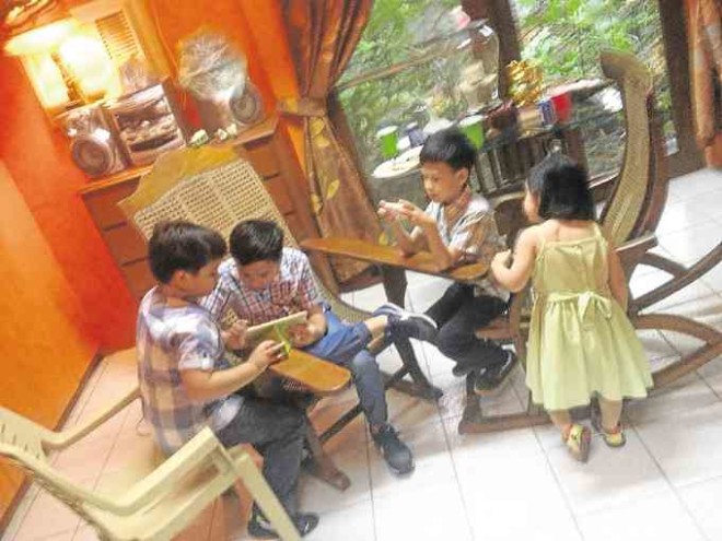 Children playing downstairs, with sliding doors to the garden