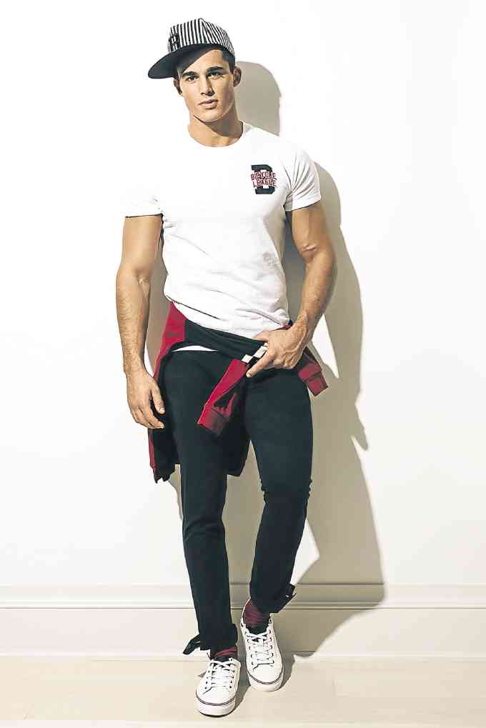 Italian model Pietro Boselli wears separates like round-neck tees, athletic hoodies, caps, joggers and jeans from the new collection of Bench.