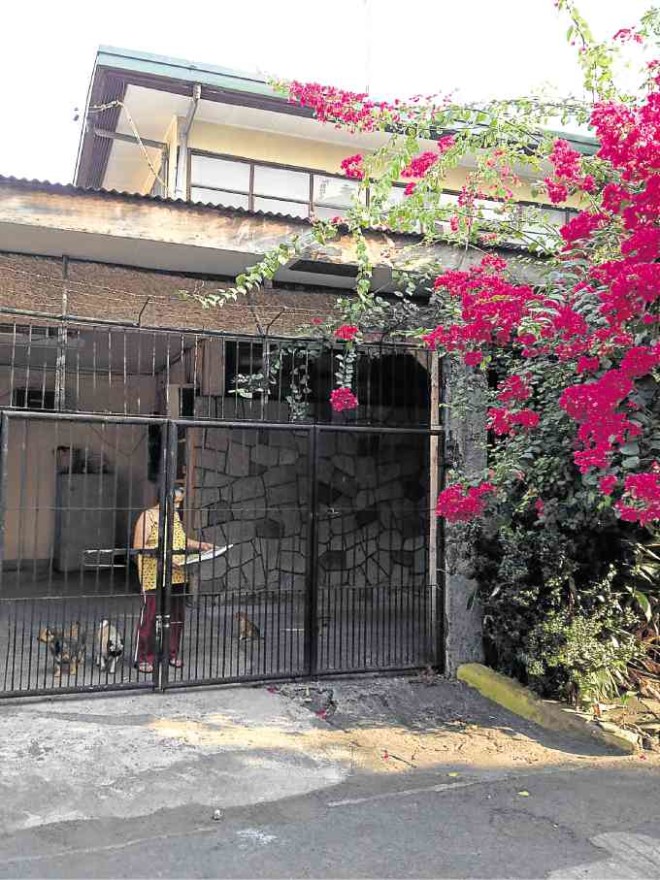 Ancestral home was a two-story house with an aged pink bougainvillea tree outside.