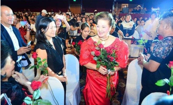 At the Waterfront ballroom, Sala Foundation’s orchestra founder Ingrid Sala Santamaria receives 77 roses representing 77 years of her life.