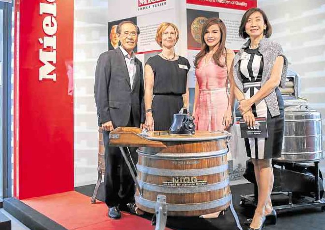 Focus Global president Steven Sy together with export manager of Miele for Southeast Asia Frauke Nitz, Miele’s brand ambassador Grace Barbers-Baja and Focus Global executive vice president Lolita Sy during the launching of Miele’s new W1T1 washing machine —PHOTOS BY JOHN PAUL R. AUTOR