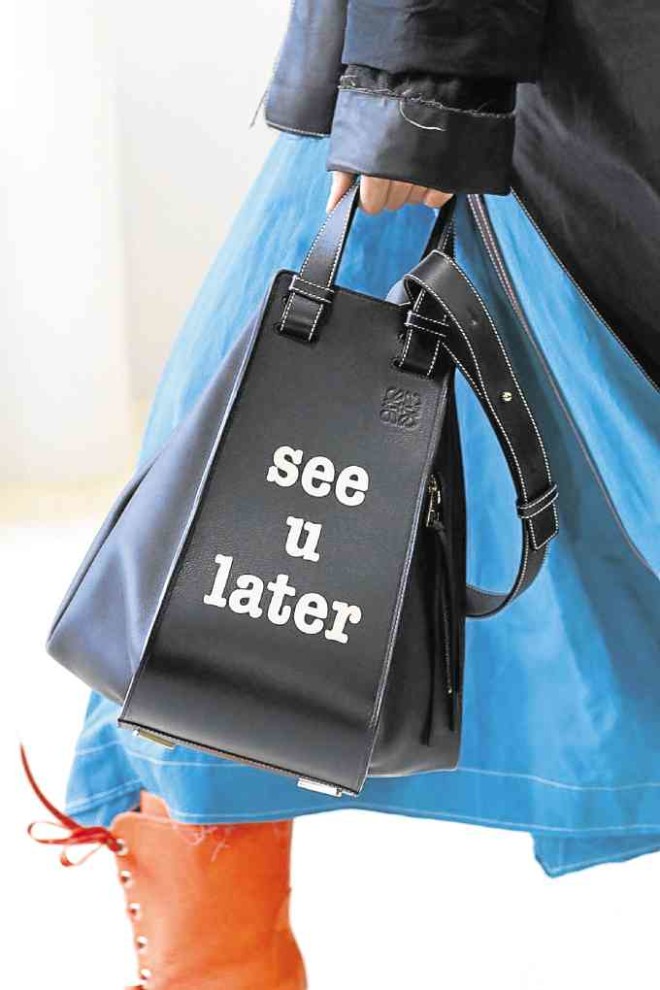 TRIANGLE Hard leather bag with flirtatious message