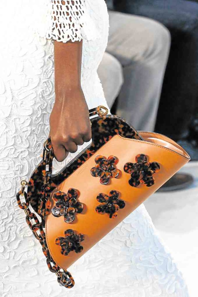 FAUX TORTOISE Michael Kors purse dotted with 3D daisies—PHOTOSFROMIMDIGITAL