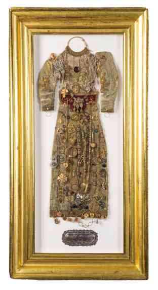 Antique Vietnamese “santo’s” dresswithmixed metal charms, jewelry and antique silver on an ex-voto plaque, all framed ingilt