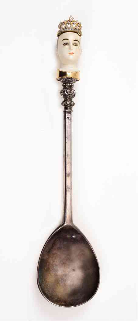 Philippine ivory “santo’s” head is atop a 19th-century silver spoon with 18k-gold and diamond.