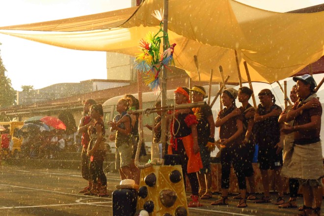 Performing “Padayon” at a community plaza in Palo, Leyte, 2014. Rain started to fall but the cast finished the performance.