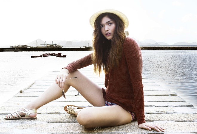 Rattan fedora, brown cardigan, printed bikini bottom, gold sandals, aviator shades, all from American Eagle Outfitters