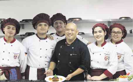 Arnold Bernardo with culinary students from Treston