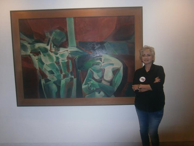 Celeste Legaspi before a 1971 painting by her father Cesar Legaspi