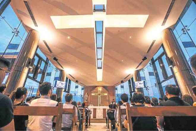 The Holy Cross design on the ceiling symbolizes Christ's protection.—PHOTOS BY JILSON TIU