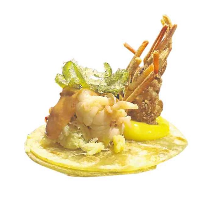 Corn “piadina,” sautéed river prawn, crab head cream sauce, candied calamansi byMargarita Forés