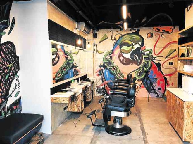 Street graffiti art adorns The Urban Barbershop in Tomas Morato, Quezon City.