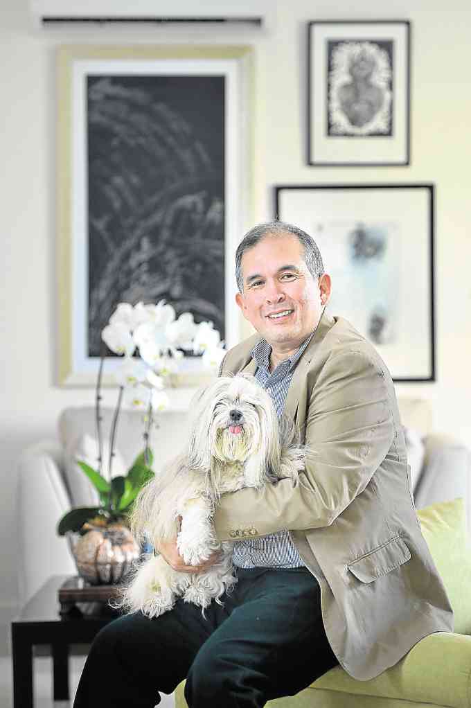 Event organizer Miguel Miñana prefers quiet time with his furry housemate.