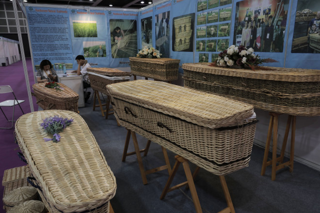 Wicker and seagrass coffins are displayed at the Asia Funeral and Cemetery Expo & Conference in Hong Kong, Thursday, May 18, 2017. The expo underscores how for some investors Asia's rapidly aging population makes its death industry a potentially lucrative market. Asia's aging population is projected to hit 923 million by mid-century, according to an Asian Development Bank, putting the region on track to become the oldest in the world. (AP Photo/Vincent Yu)