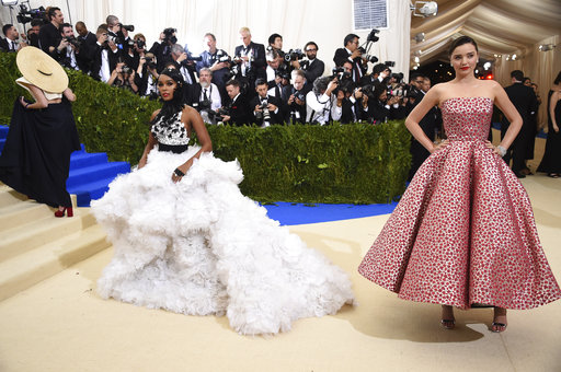 Janelle Monae, left, and Miranda Kerr attend The Metropolitan Museum of Art's Costume Institute benefit gala celebrating the opening of the Rei Kawakubo/Comme des Garçons: Art of the In-Between exhibition on Monday, May 1, 2017, in New York. (Photo by Evan Agostini/Invision/AP)
