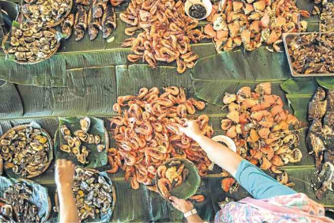 Mounds and mounds of seafood are served during the three-day festival in Roxas City