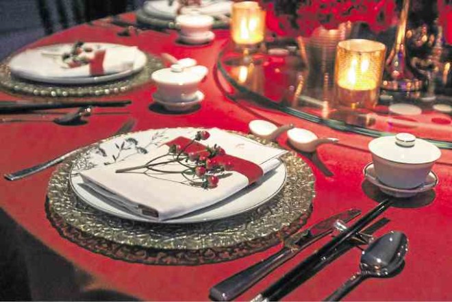 Red berries to accent the place settings