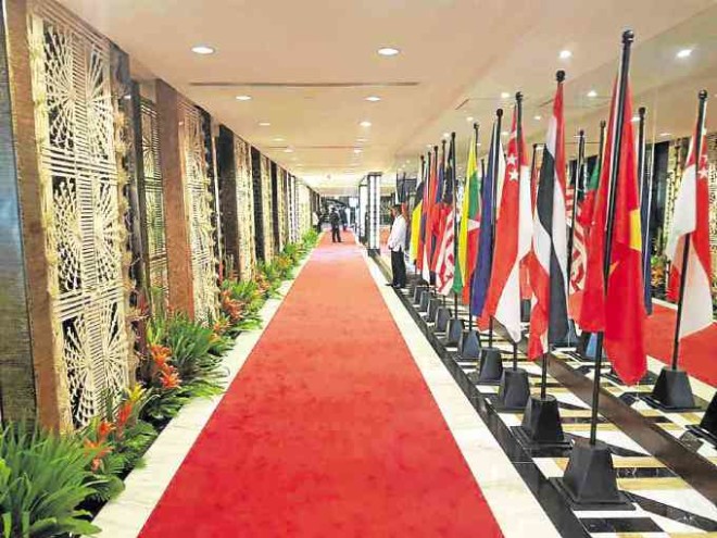 "Singkaban" panels and flags of member countries of Asean line the corridor leading to the ballroom.